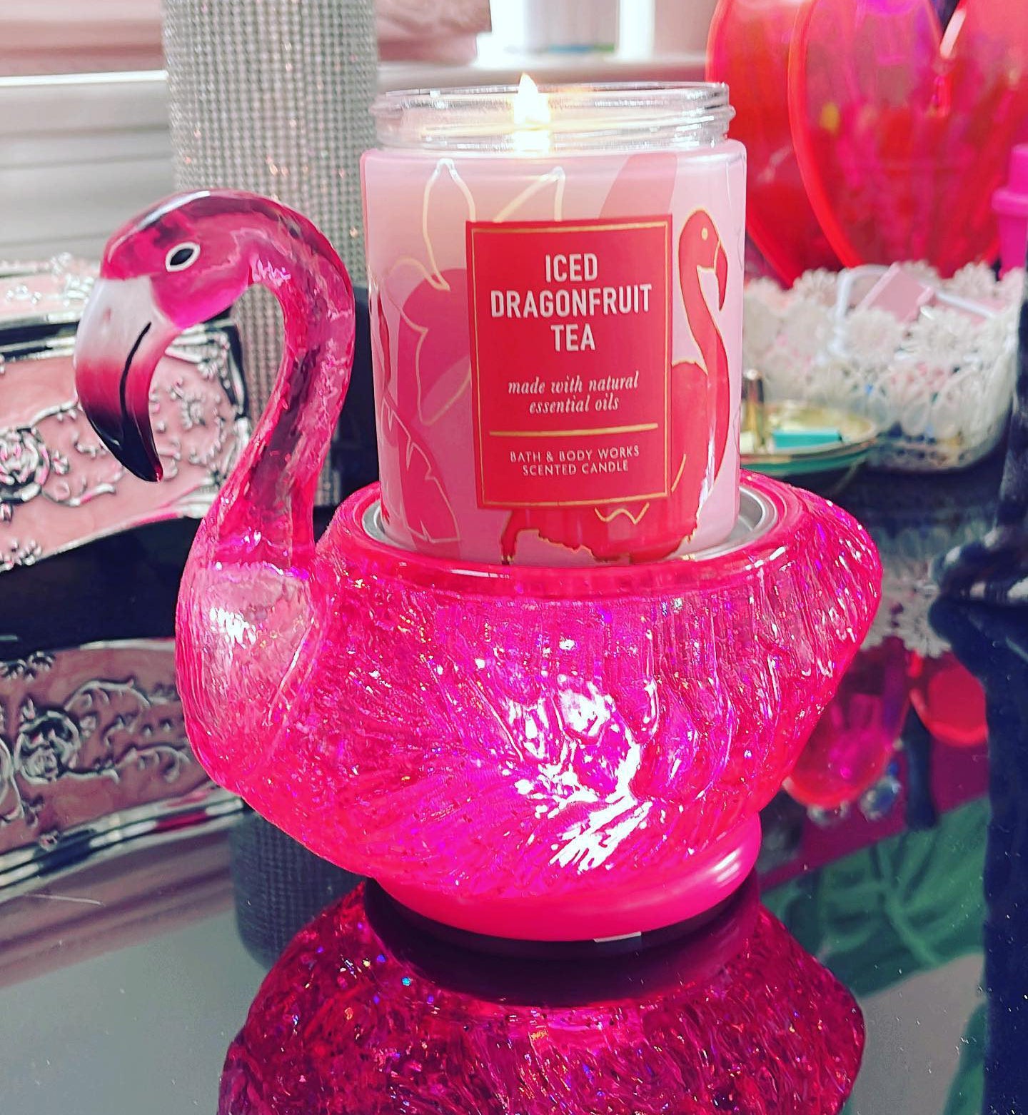 iced dragonfruit tea candle lit on a holder