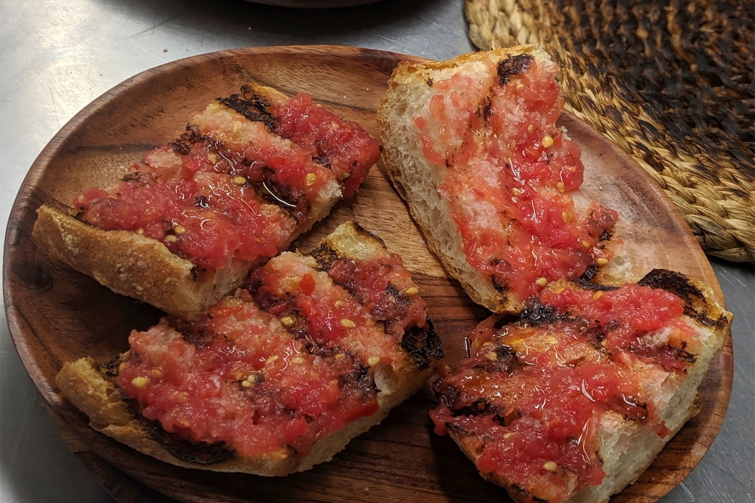 Spanish pan tomate, bread topped with grated tomatoes.