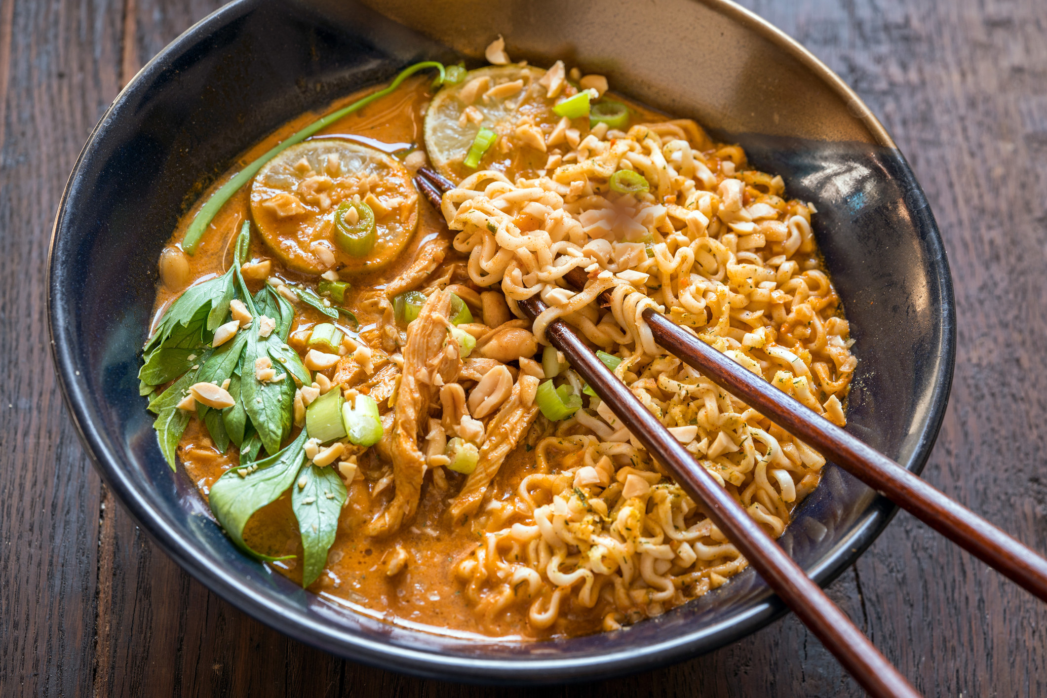 Ramen soup with peanut sauce and chicken.