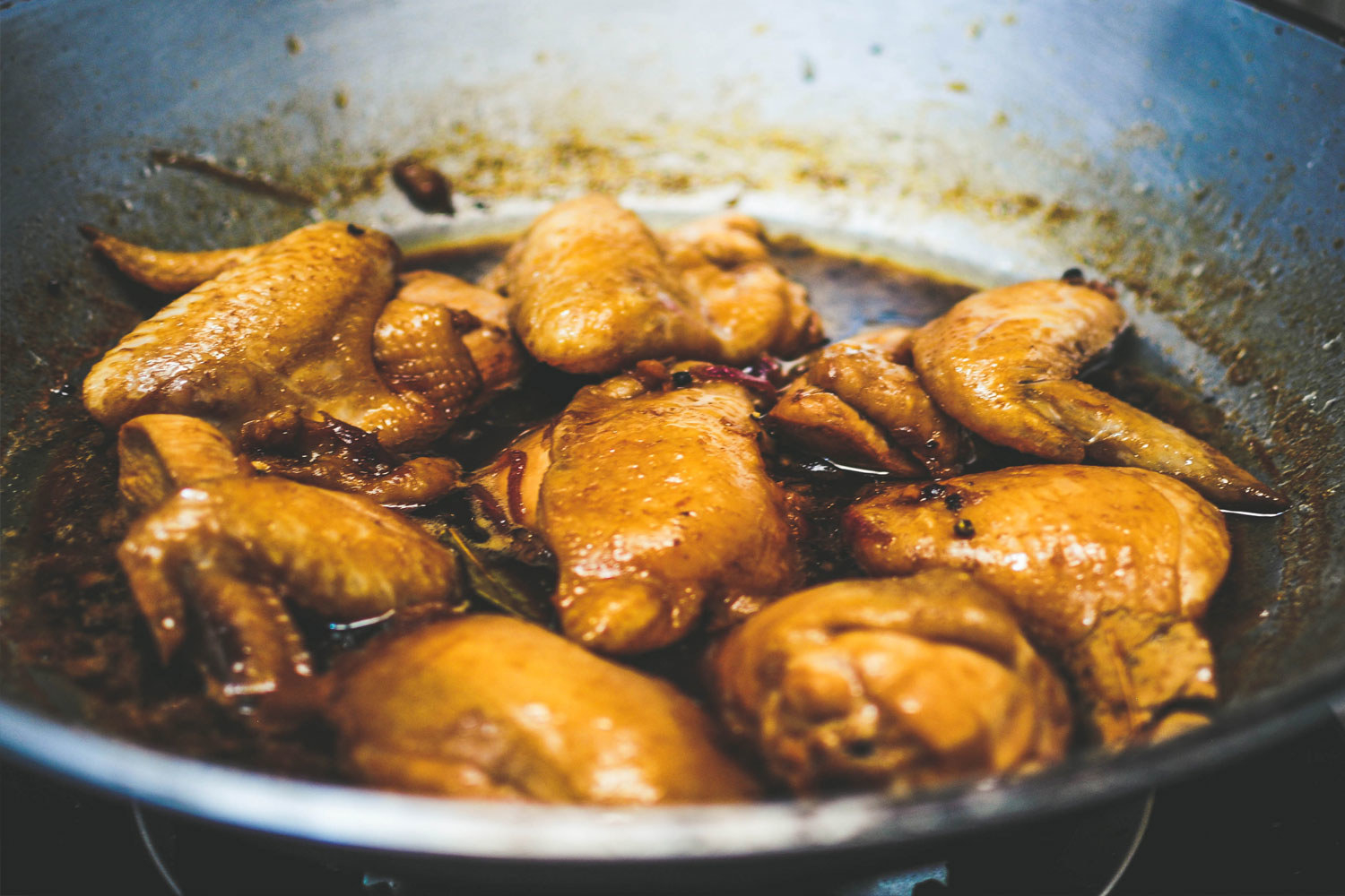 Cooking adobo chicken.