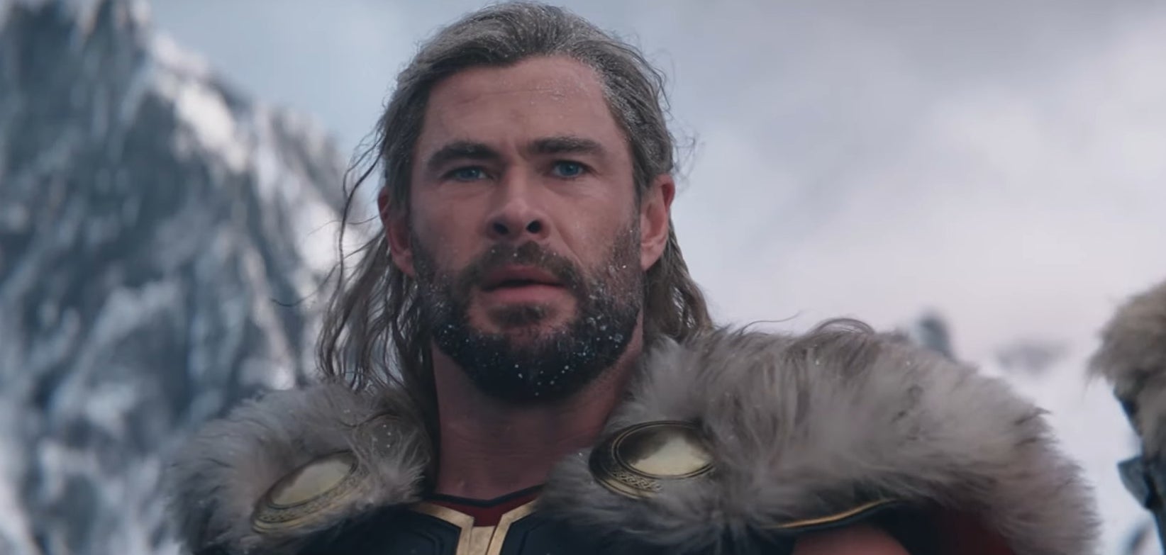 Thor standing on a snowy planet in "Thor: Love and Thunder"