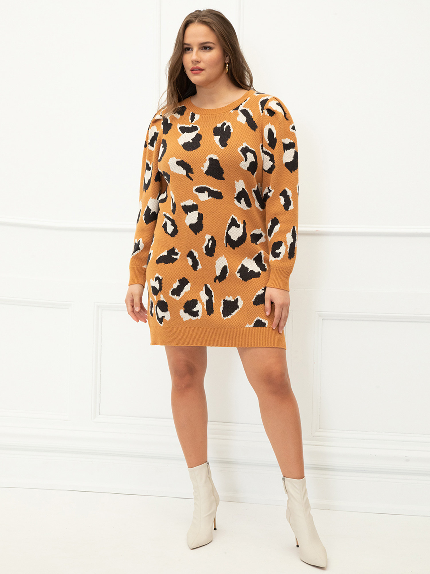 model wearing the cheetah print sweater dress