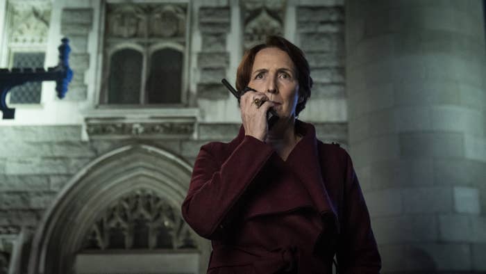 Carolyn in killing eve with a walkie talkie