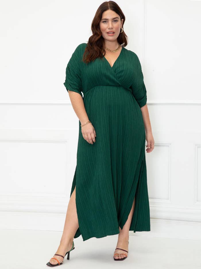 a model wearing the dress in green