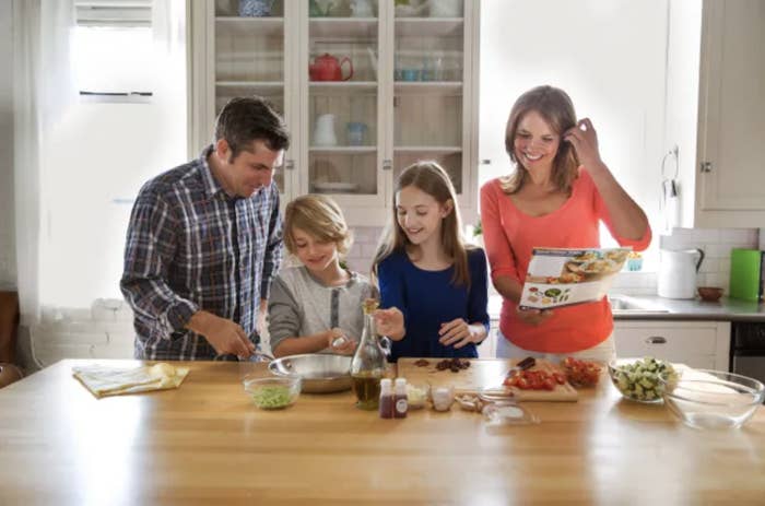 Family making Blue Apron meal