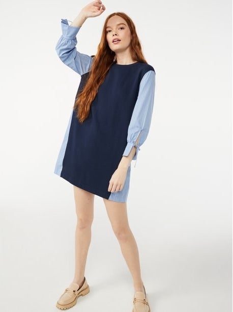 a model wearing the blouse dress combo