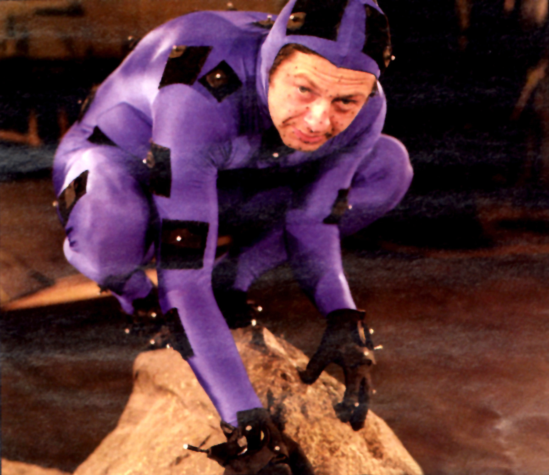 Andy Serkis in a purple suit