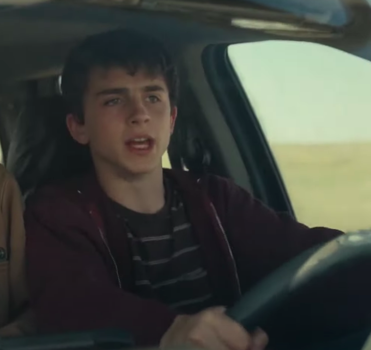 Timothee Chalamet driving a car.