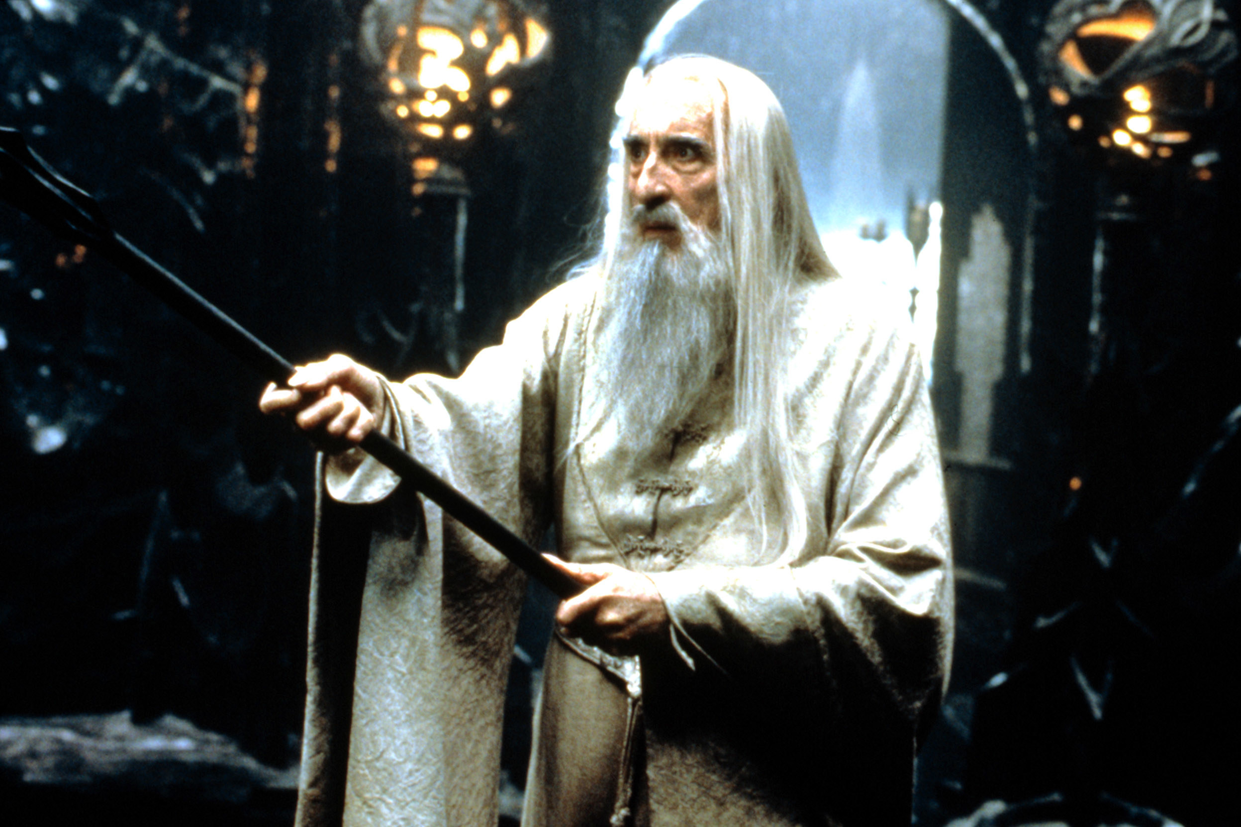 Saruman wielding a wand