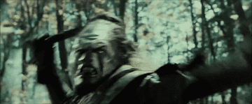 Lurtz throwin his knife and Aragorn whacking it