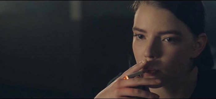Anya Taylor-Joy smokes a cigarette