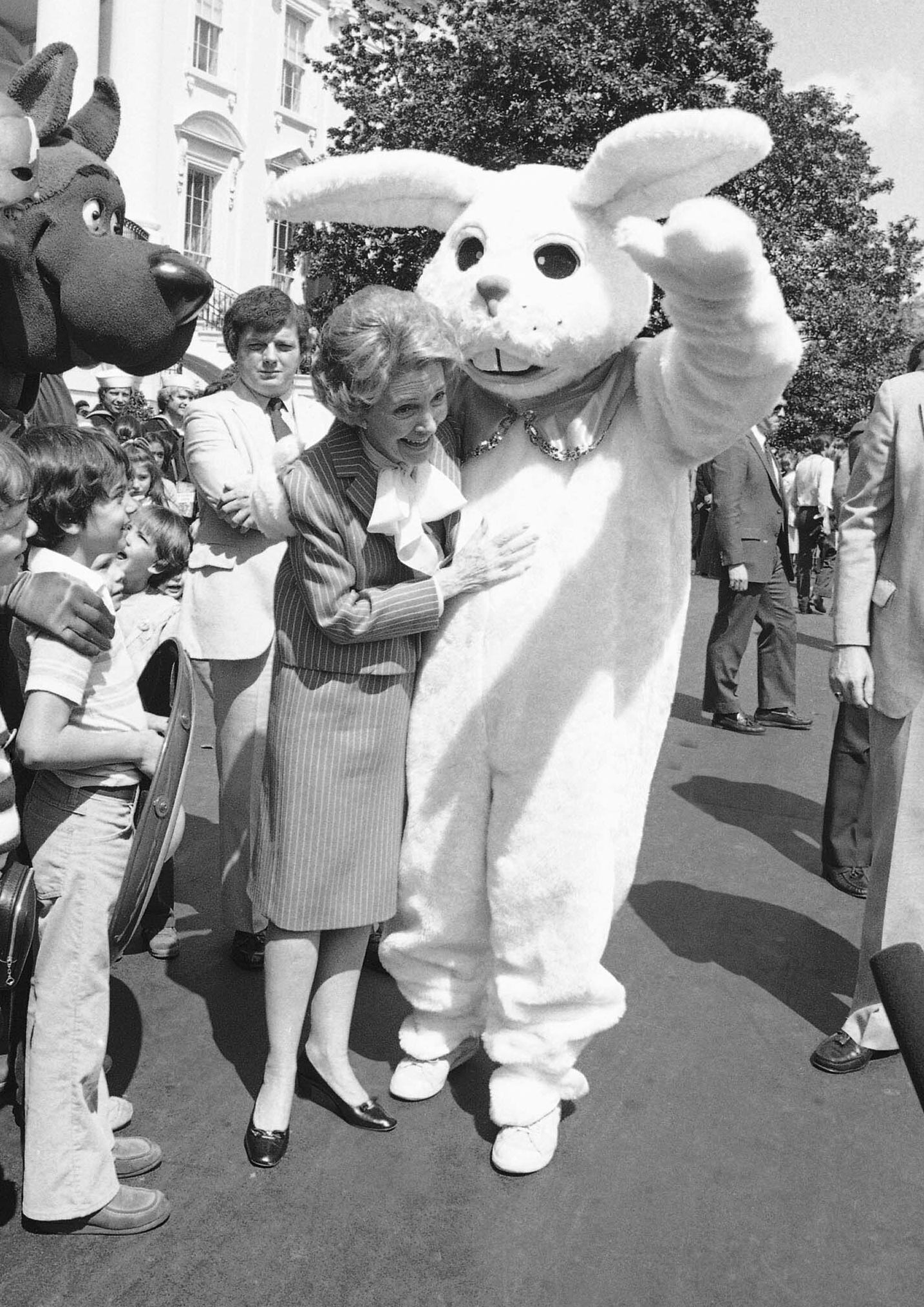 Nancy Reagan hugs a bunny costume