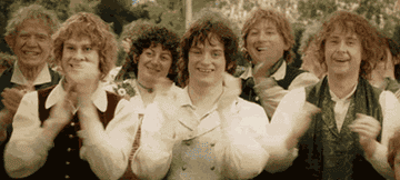 A group of hobbits clapping
