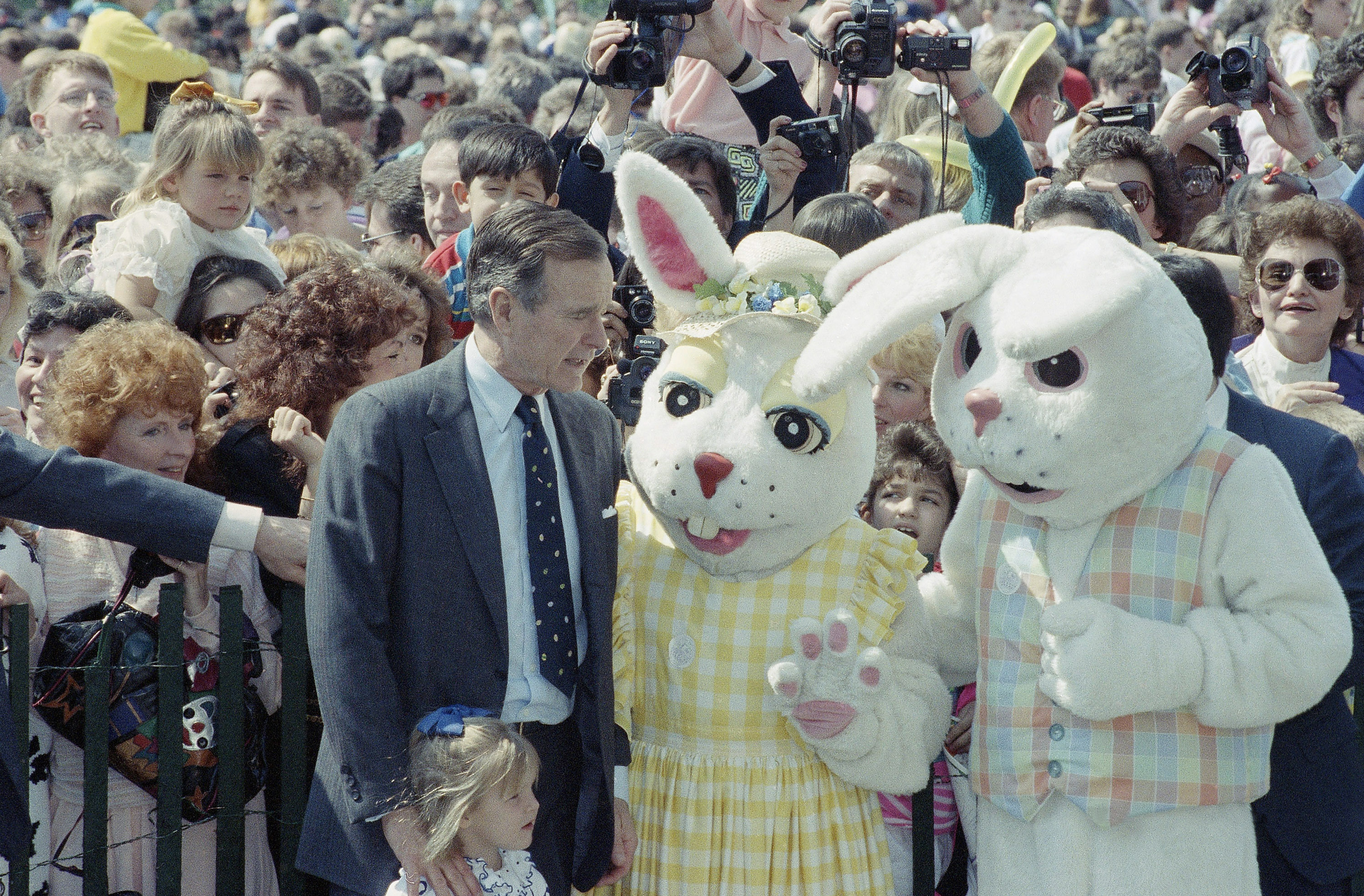 George H W Bush is seen with two giant rabbits, one of which looks menacing