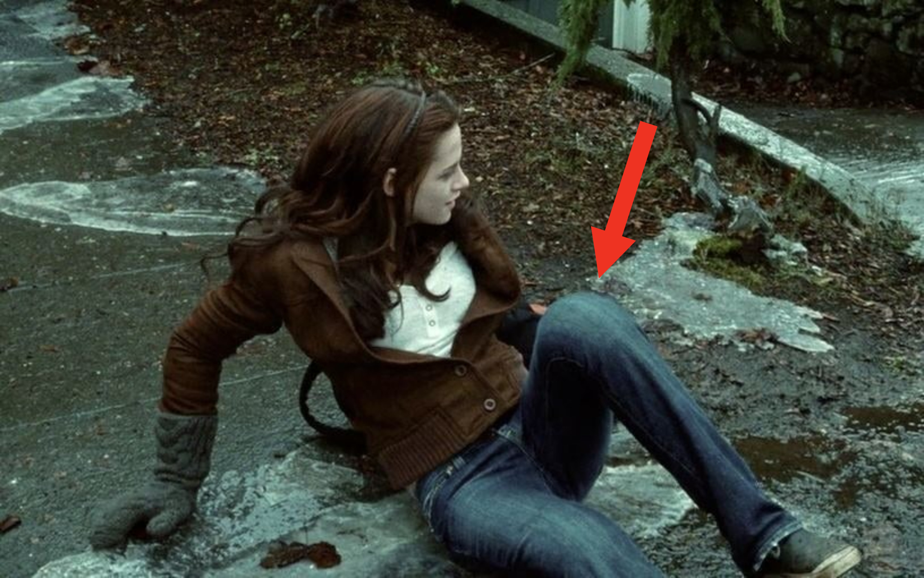 An arrow pointing to Bella&#x27;s knee pads from a scene in &quot;Twilight.&quot;