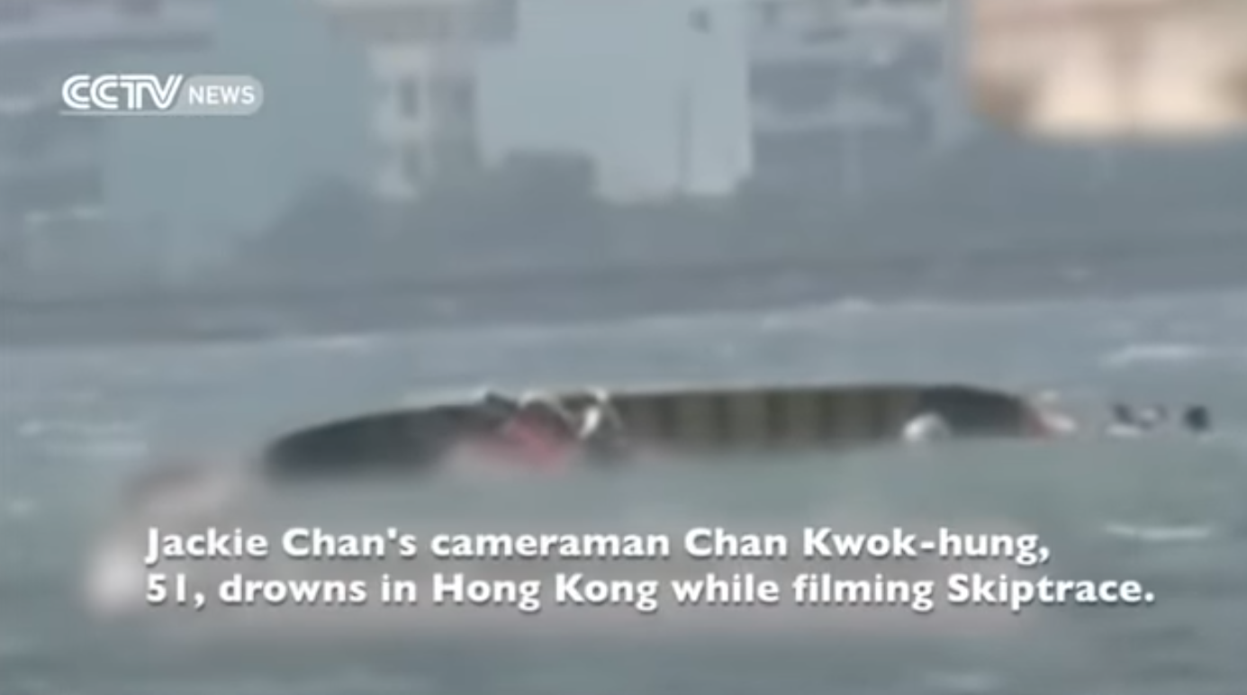 News footage of the boat that capsized on the set of &quot;Skiptrace,&quot; with text that reads, &quot;Jackie Chan&#x27;s cameraman Chan Kwog-hung, 51, drowns in Hong Kong while filming Skiptrace.&quot;