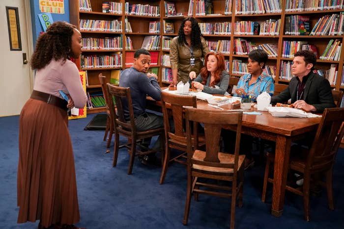 a group of teachers in a school library