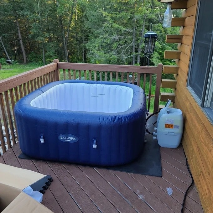 the blue inflatable pool on a deck