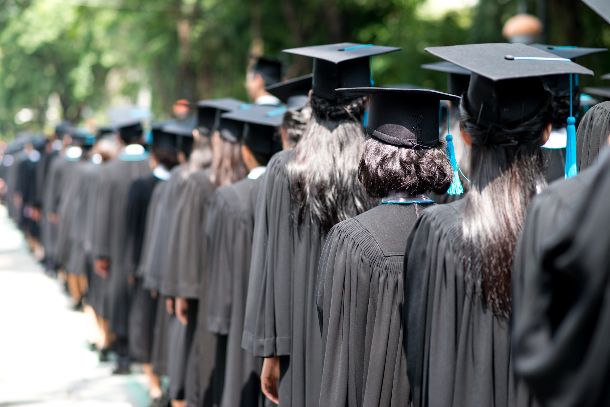 Graduates lined up at a commencement ceremony.