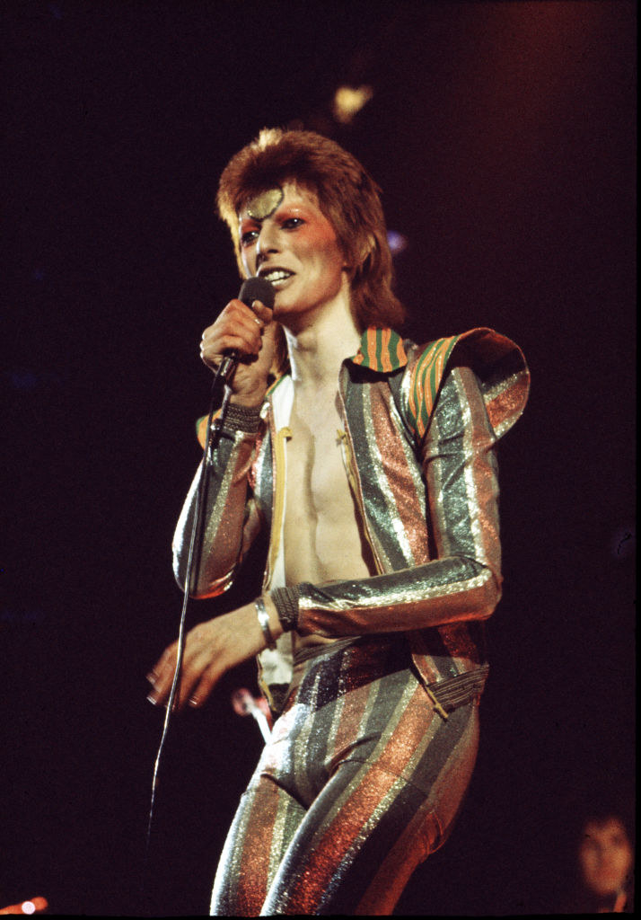 David Bowie performing onstage.