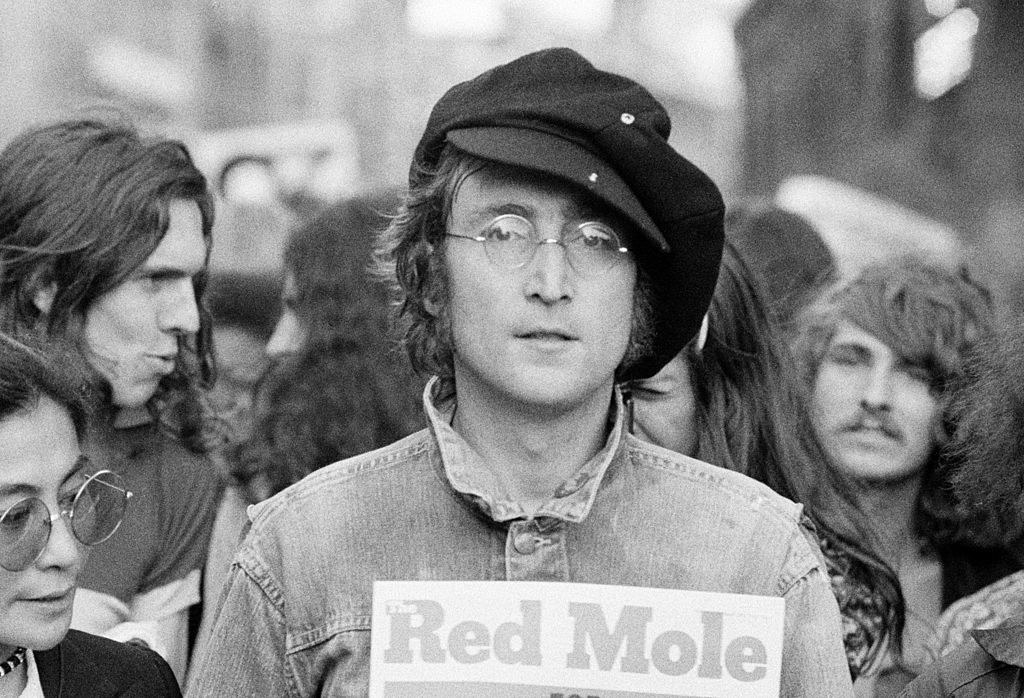 John Lennon and Yoko Ono in a crowd.