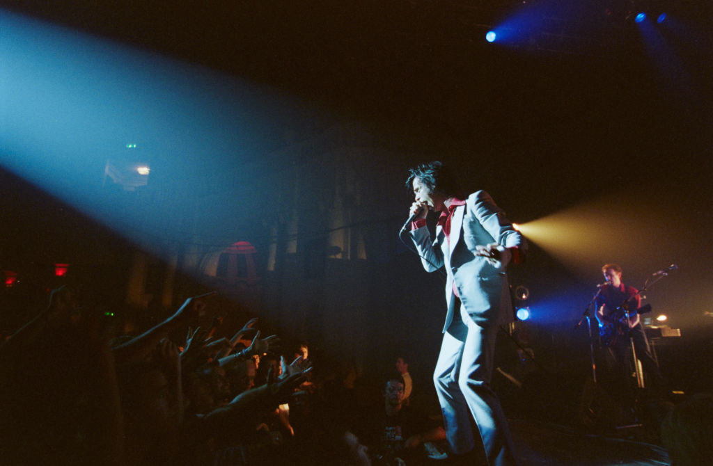 Nick Cave performing onstage.