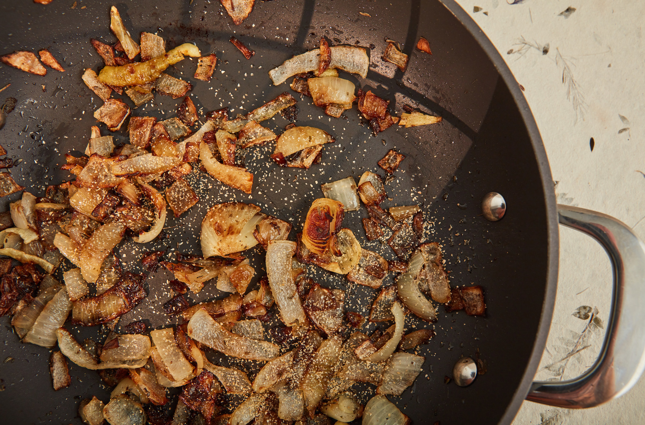 Caramelizing onions in a pan.
