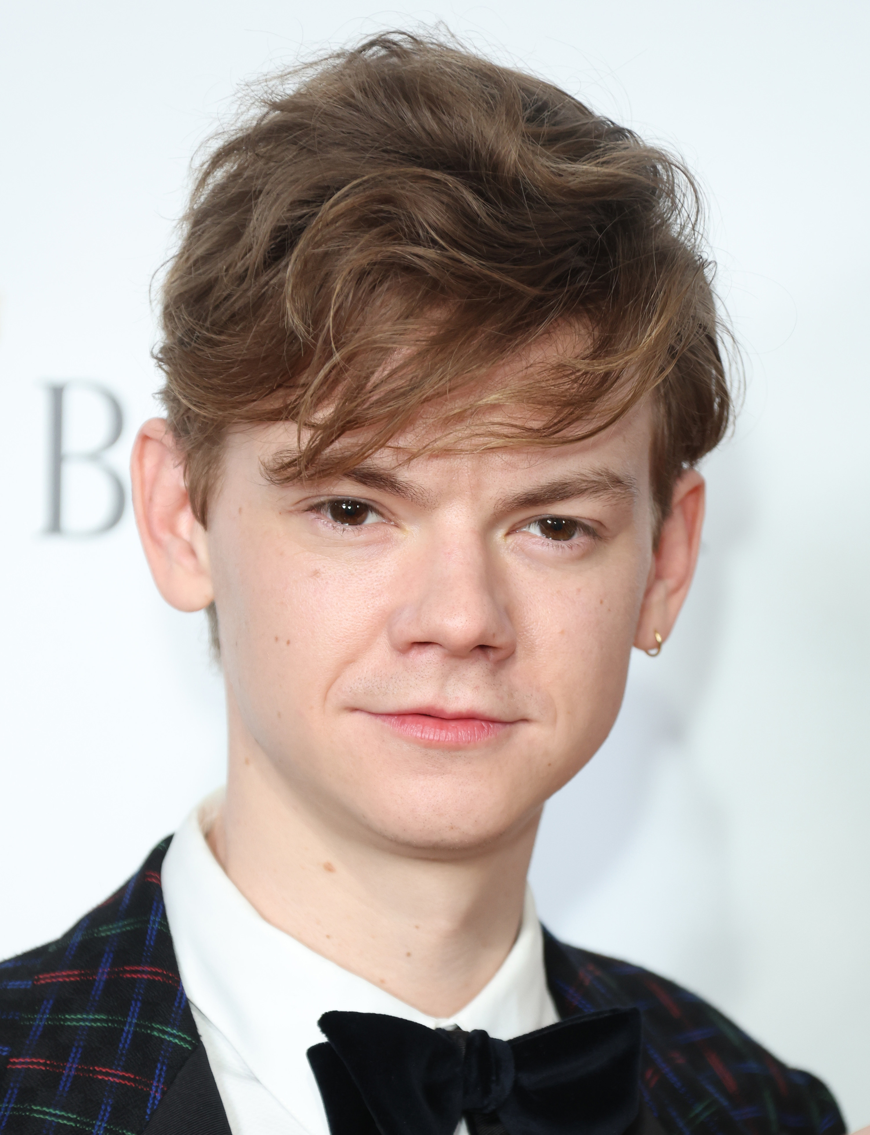 close up of Thomas with an earring