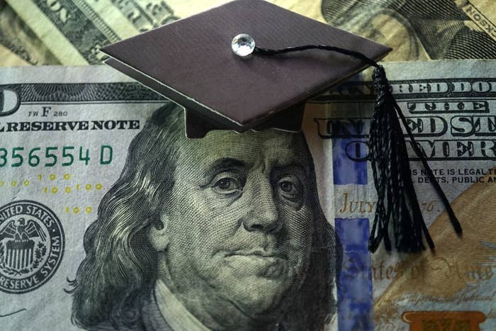 Hundred dollar bill with a graduation cap on Ben Franklin&#x27;s head