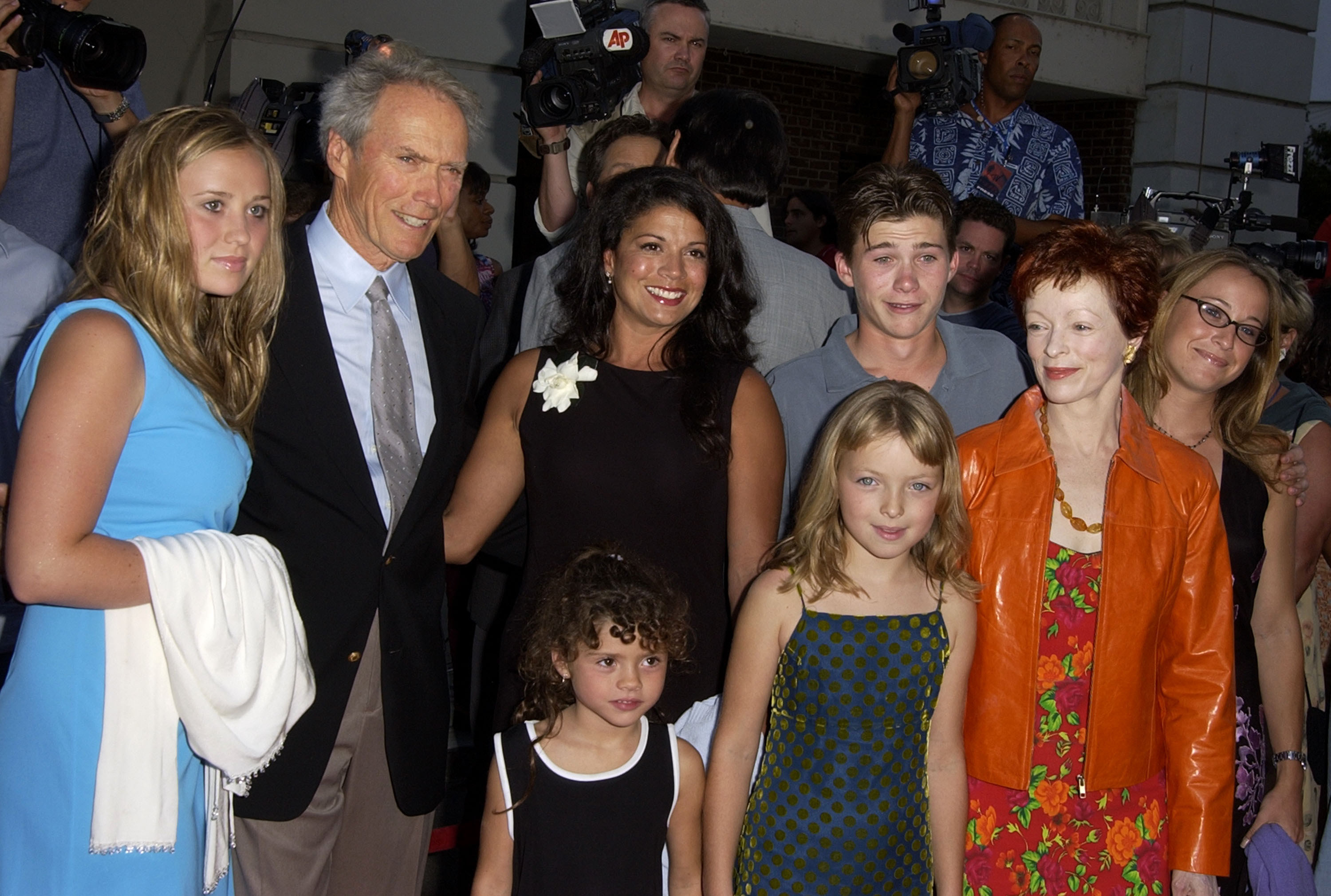 Clint poses with some of his children at an event