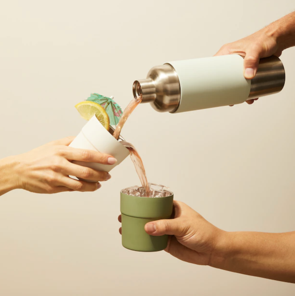 two people using the magnetic tumbler and flask set to pour chilled beverages