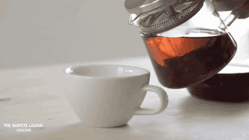 tea pouring into a cup