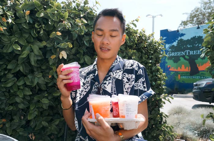 The author carrying a carousel of Starbucks drinks