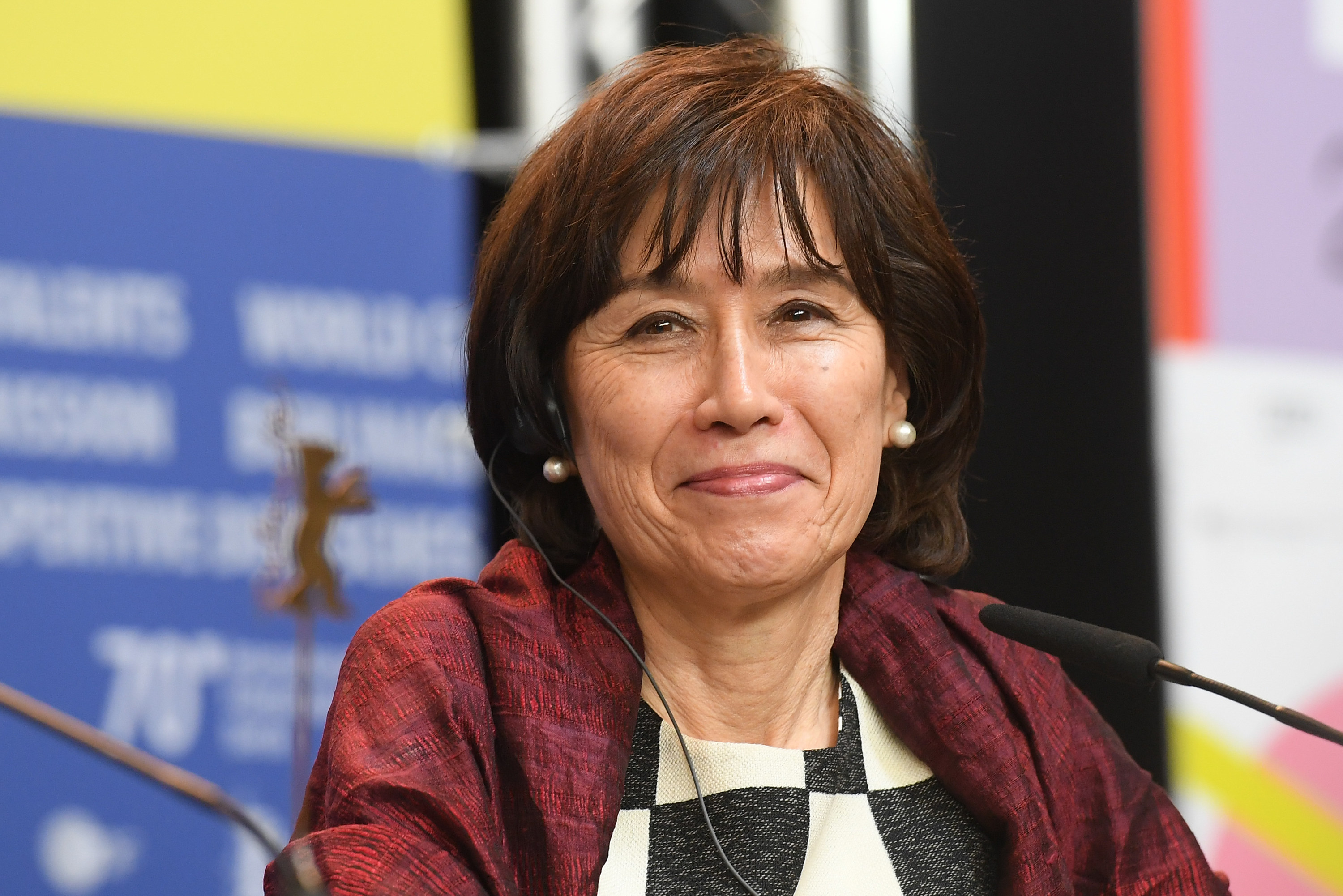 Aileen Mioko Smith sits at a press conference for &quot;Minamata&quot; during the Berlinale International Film Festival