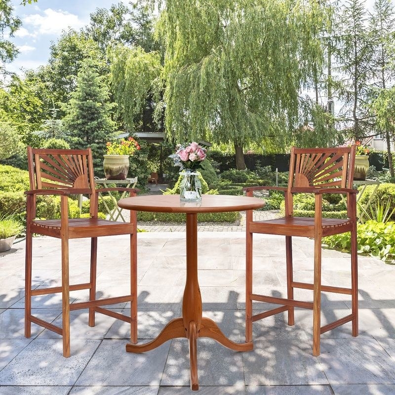 a set of acacia wood bar stools with rising sun design