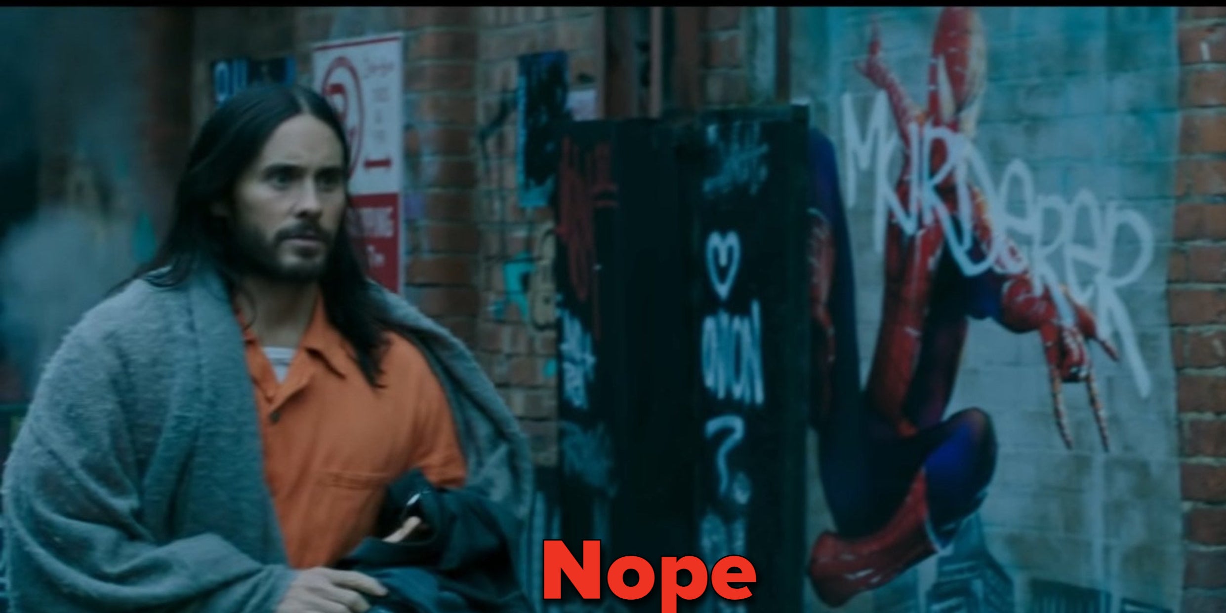 Morbius running past a mural of Spider-Man