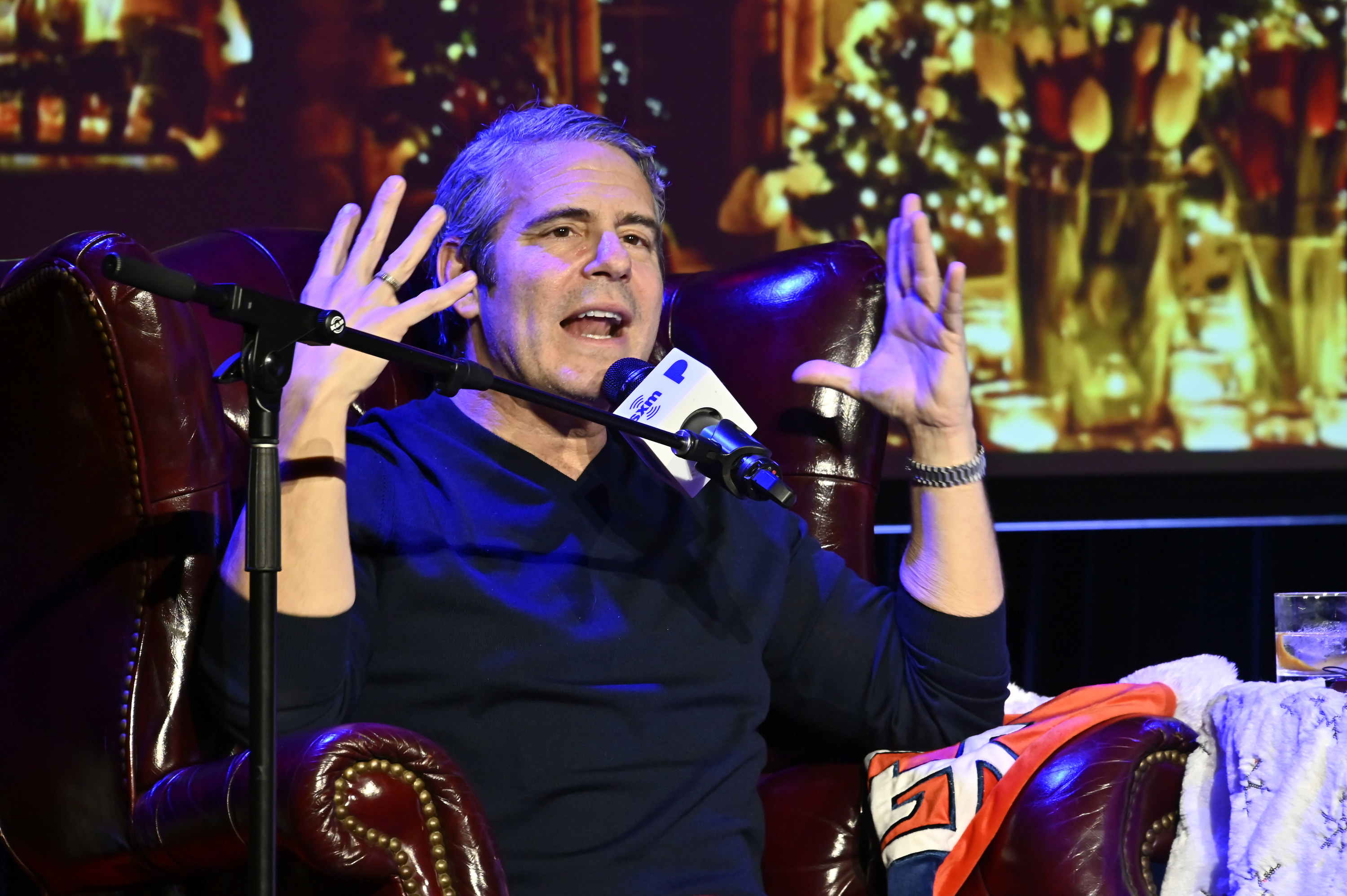 Andy Cohen talking and gesturing with his hands