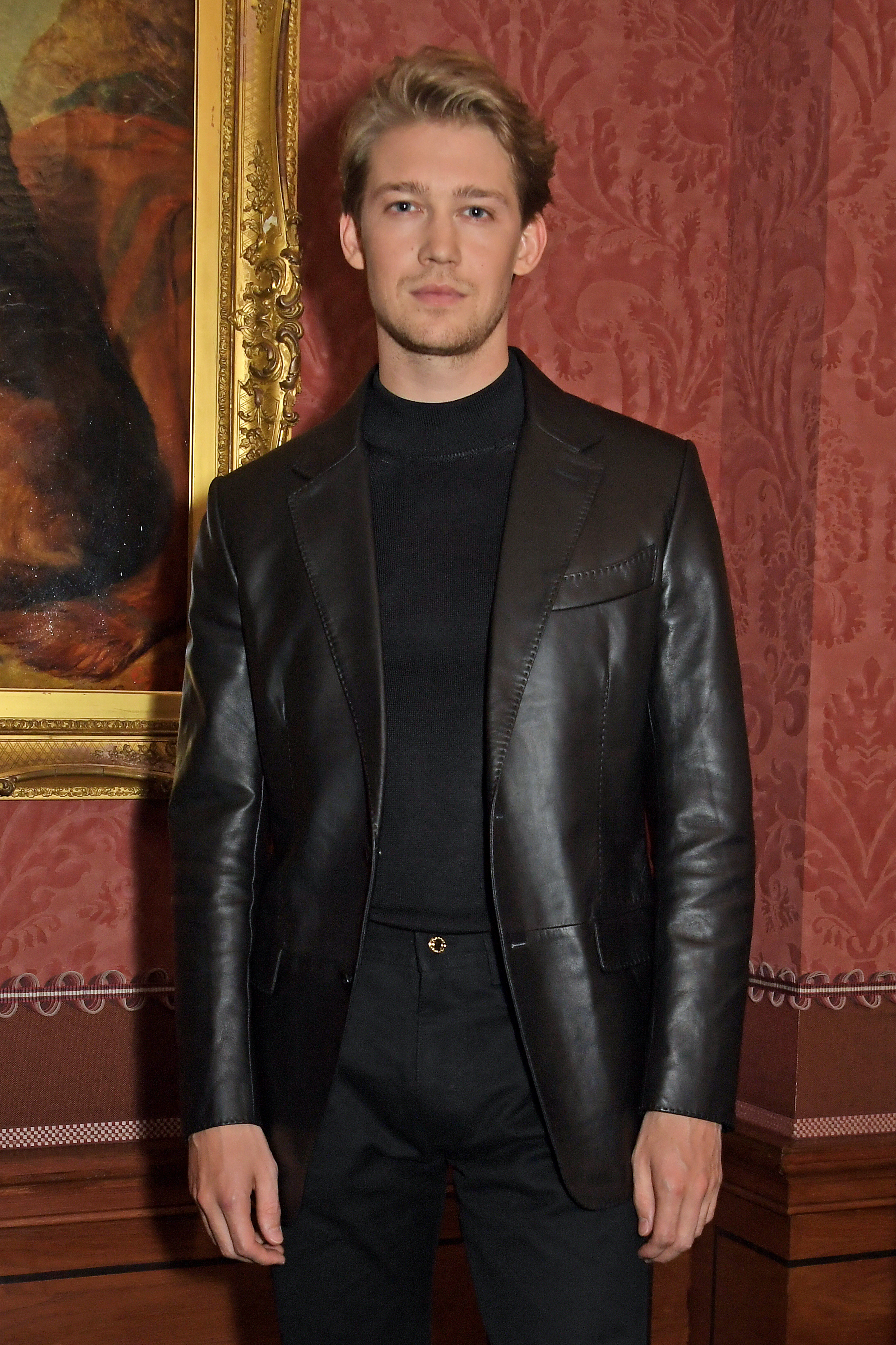 Joe posing in a leather jacket