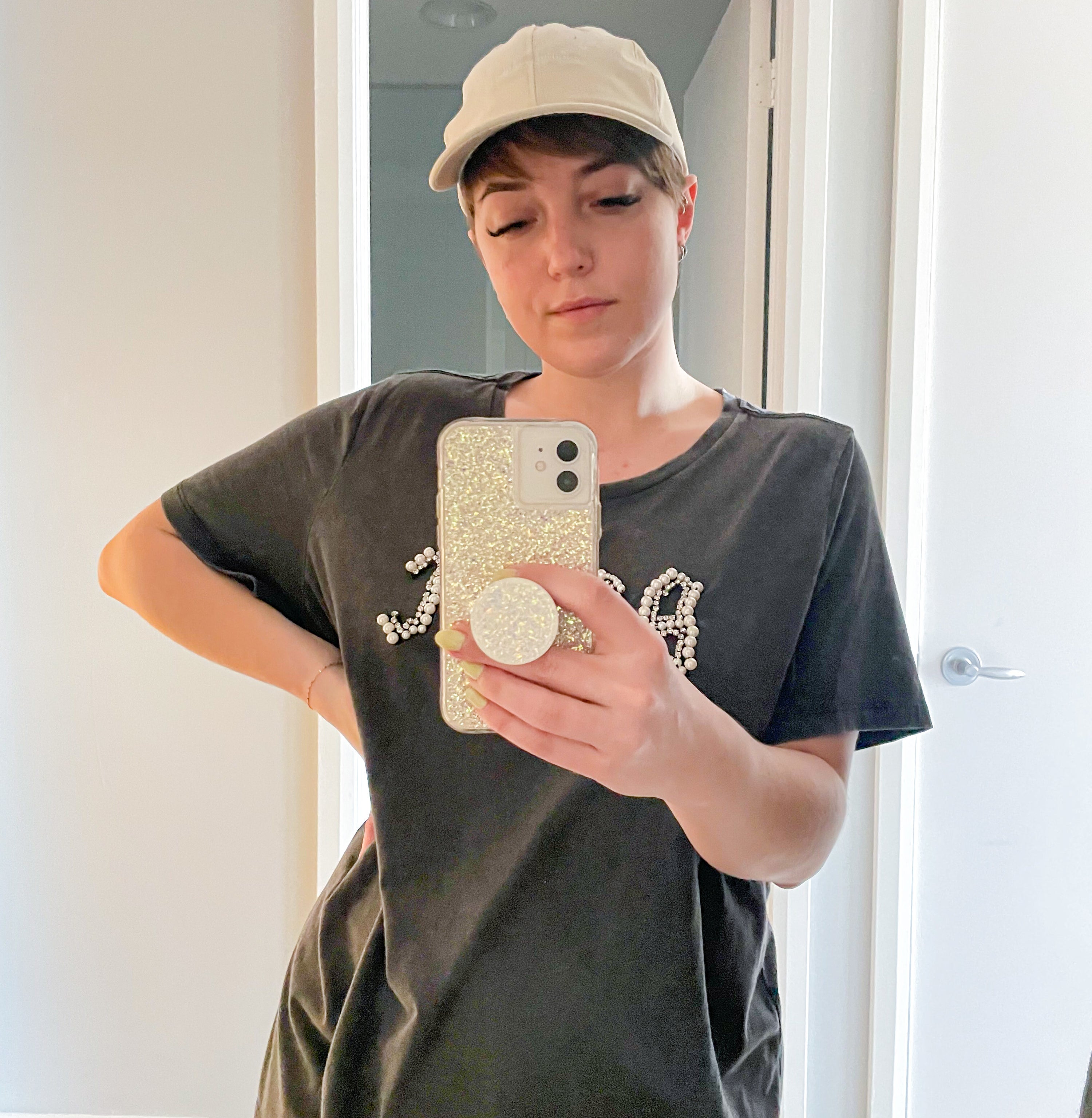 victoria wearing the cap while taking a selfie
