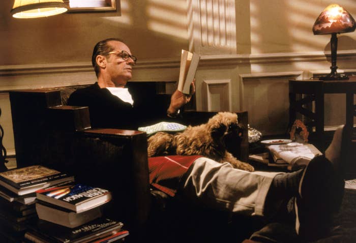 Jack Nicholson with the dog sitting on his lap