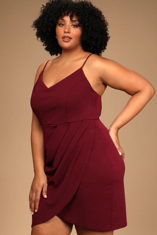 An image of a model wearing a wine bodycon dress with a lightweight stretch knit fabric