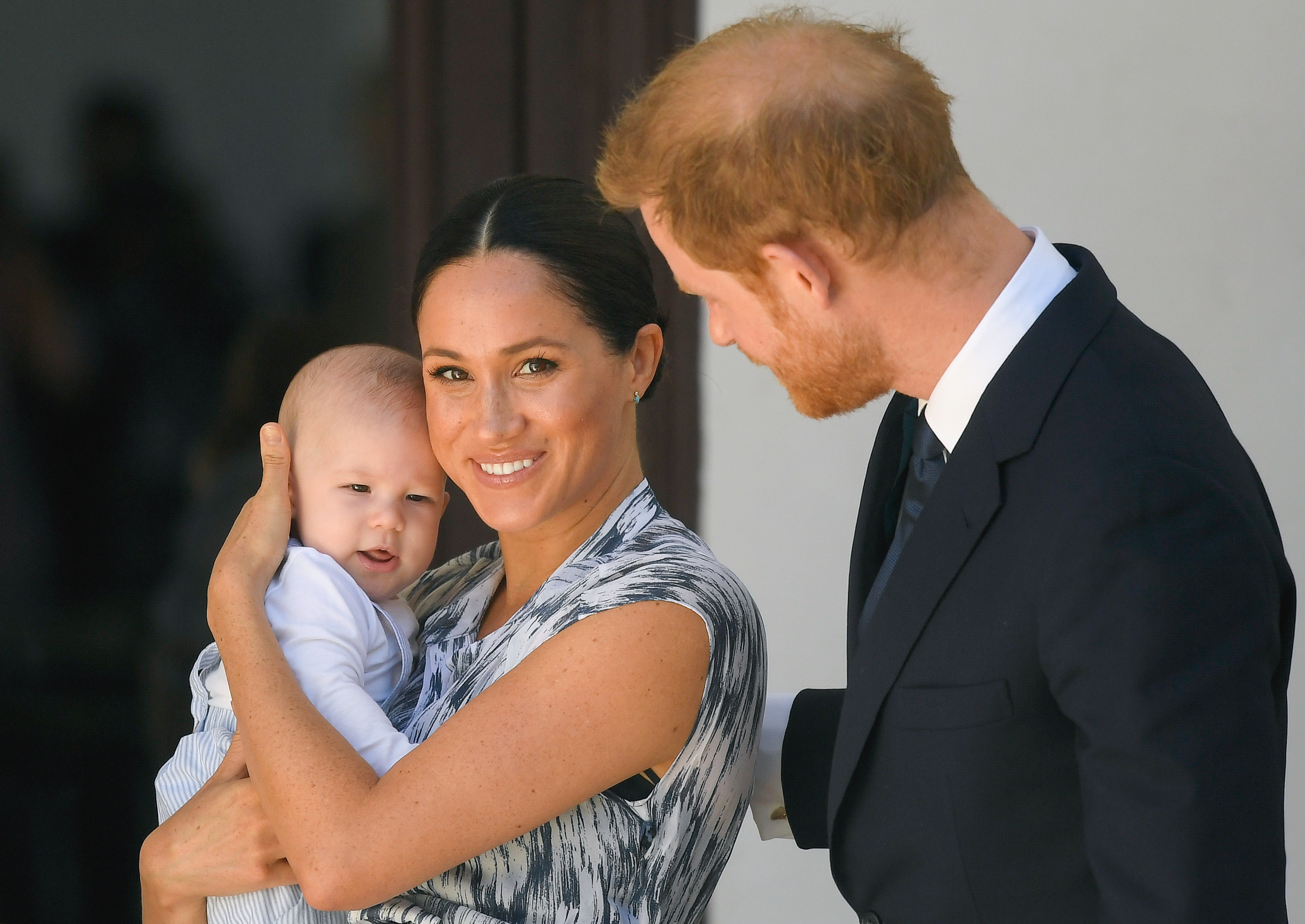 A closeup of Meghan and Harry and Archie