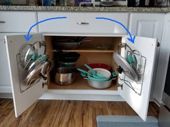 Reviewer image of silver pot lid organizer mount on white cabinet doors