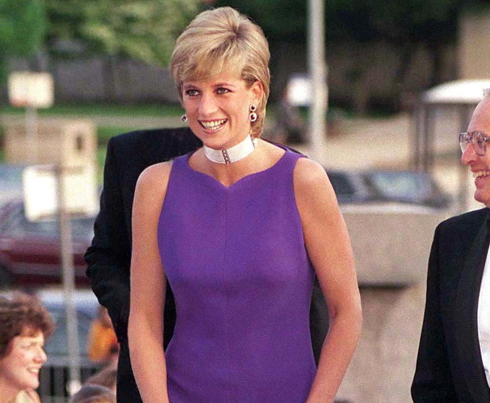 Diana smiles while walking into an event