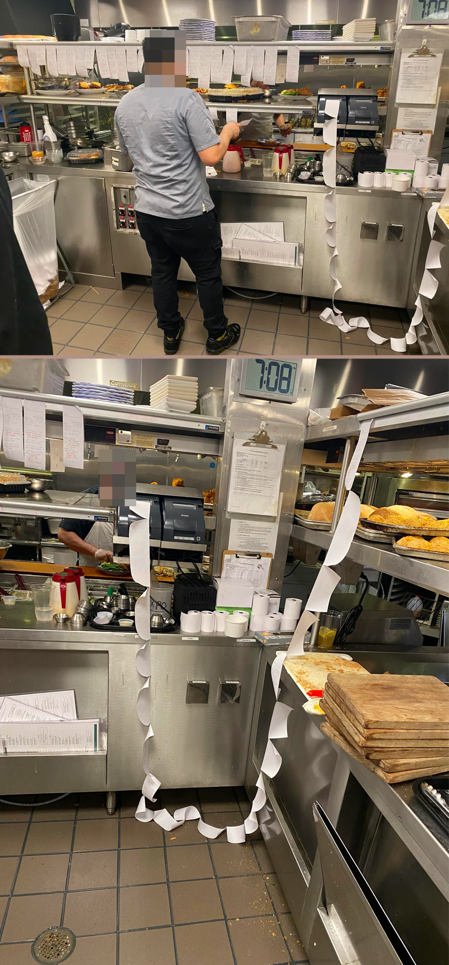 A row of ticket orders in a kitchen that extends from the register down to the floor and up again