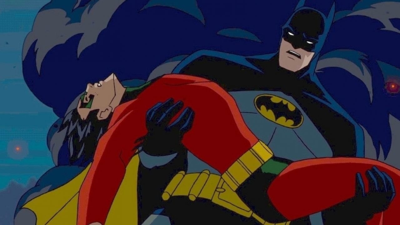 batman holds robin&#x27;s limp body