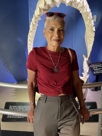 Reviewer wearing the red cropped top