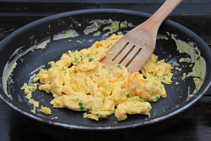 A skillet of scrambled eggs.