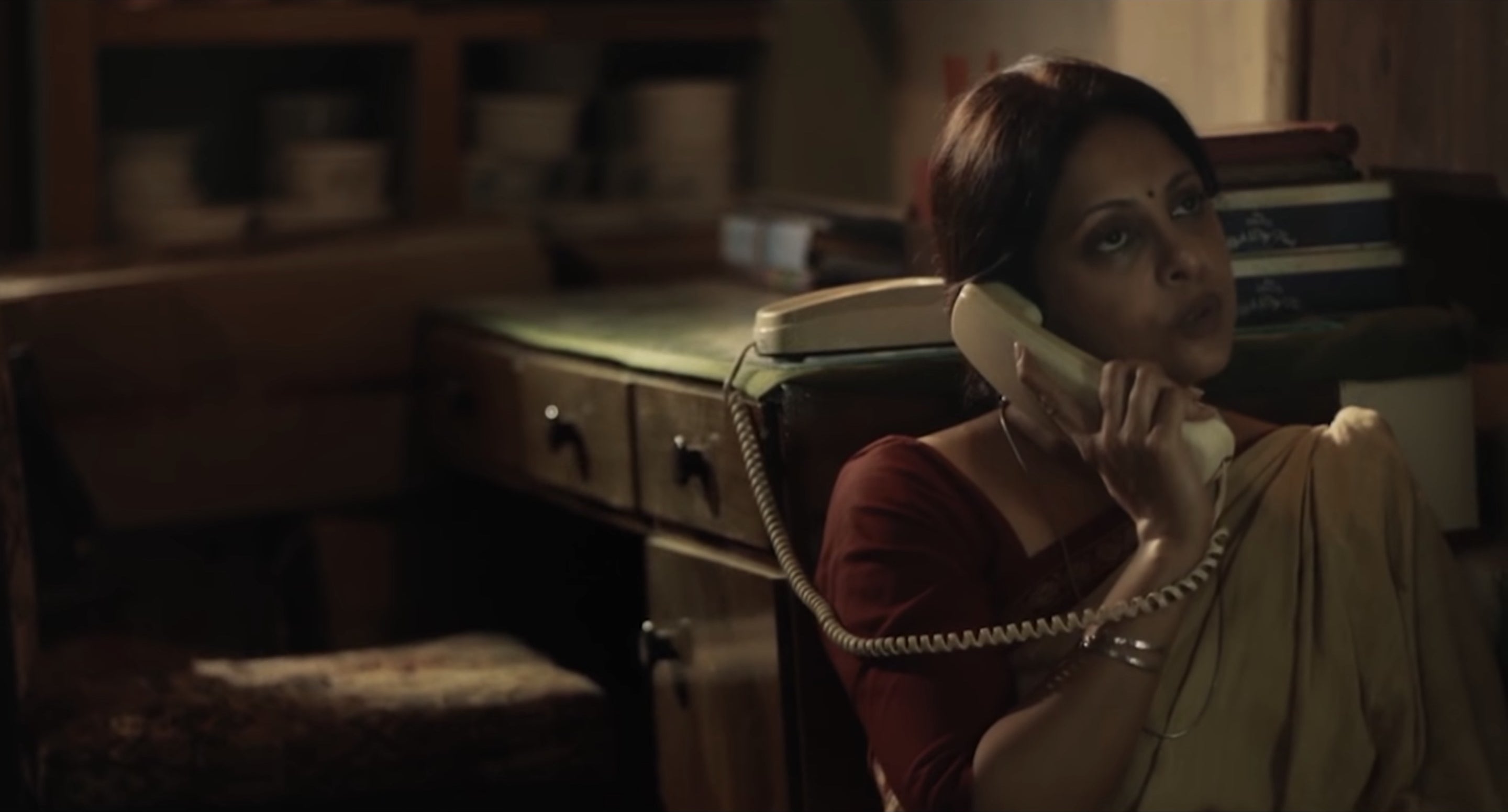 Shefali Shah speaking on a telephone in a still from the film