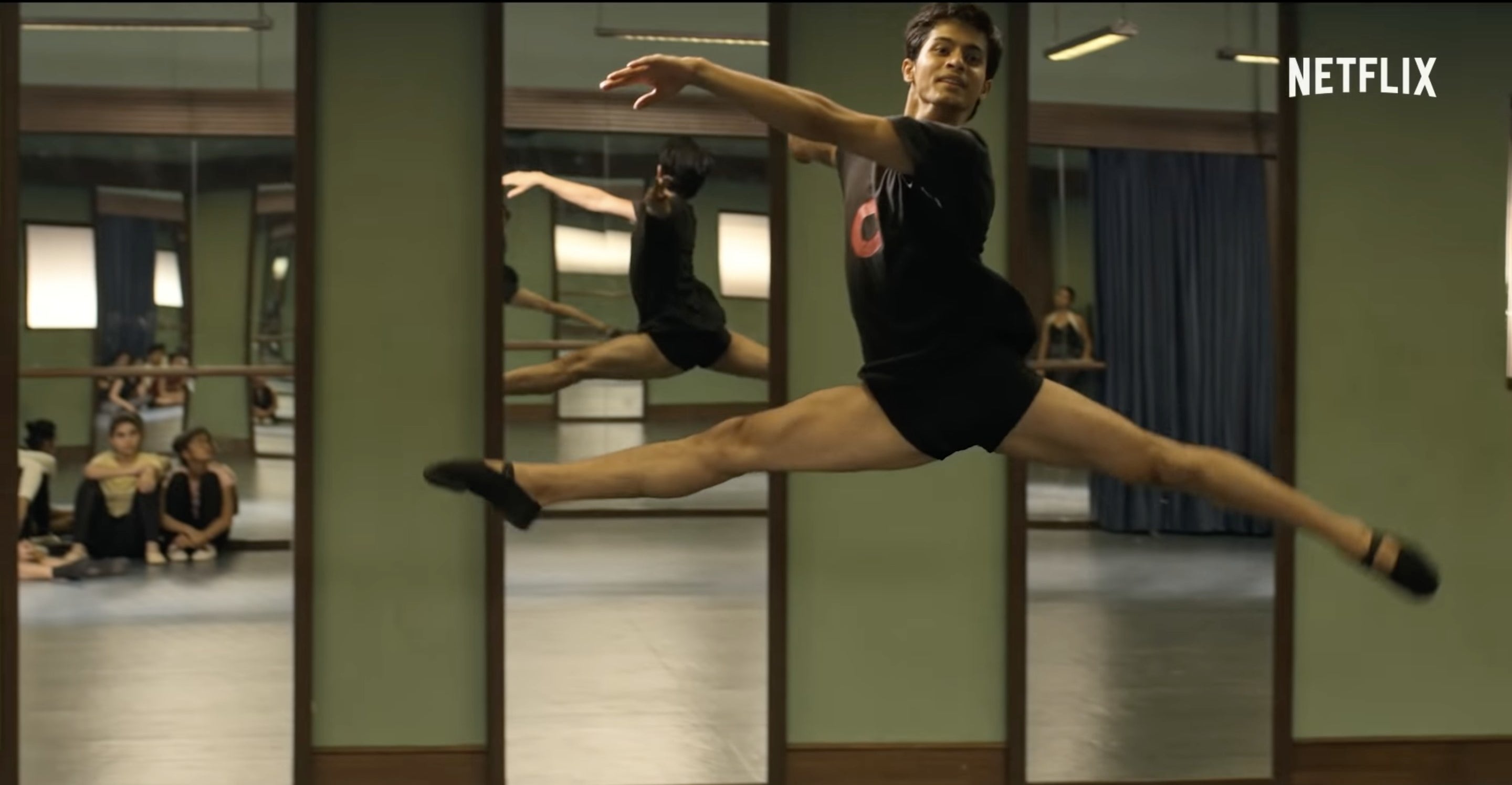 A boy performing ballet in a still from the movie